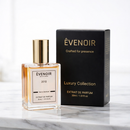 30ml luxury perfume bottle with gold cap and black box on marble surface