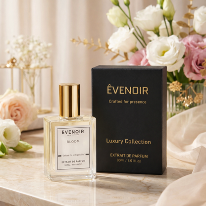 Bloom perfume 30ml Extrait de Parfum bottle and black luxury box on marble with flowers